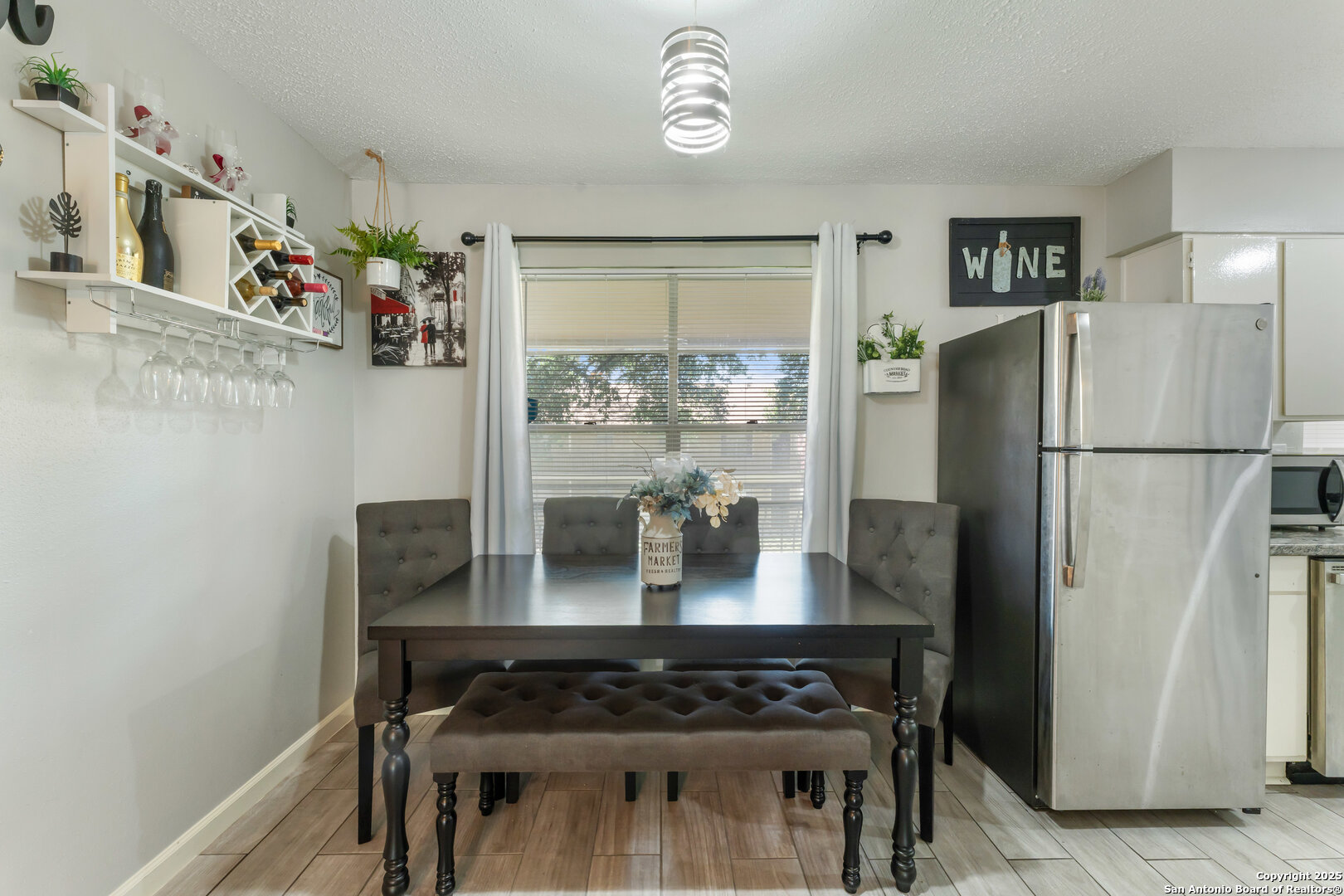 923 Vance Jackson Road, Unit 1104 San Antonio, TX 78201 - Photo 7 of 18 a kitchen with stainless steel appliances granite countertop a refrigerator and a stove top oven