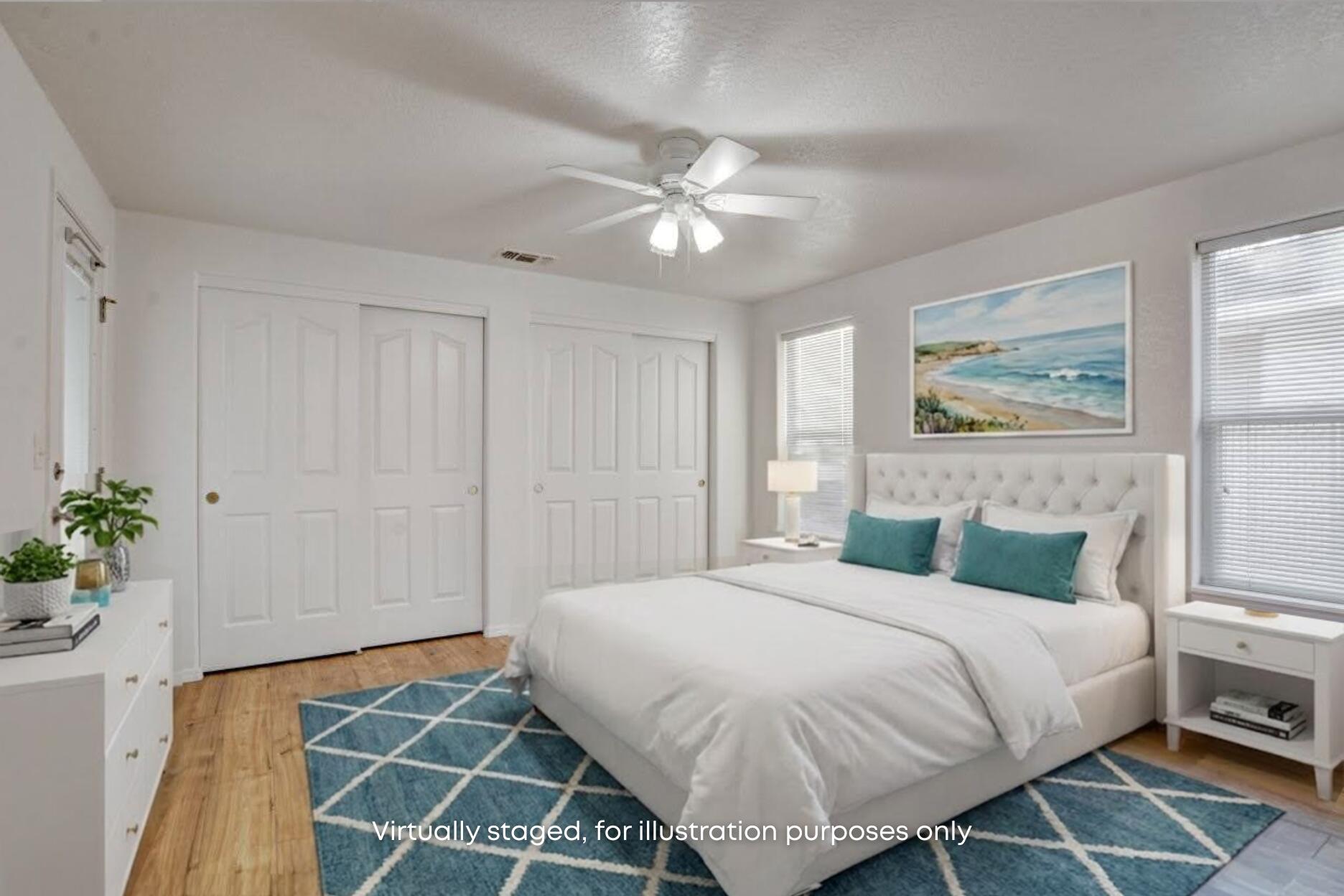 417 Crystal Drive Eagle Point, OR 97524 - Photo 17 of 35 a bedroom with a large bed and a chandelier