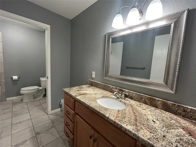 a bathroom with a toilet and bathtub