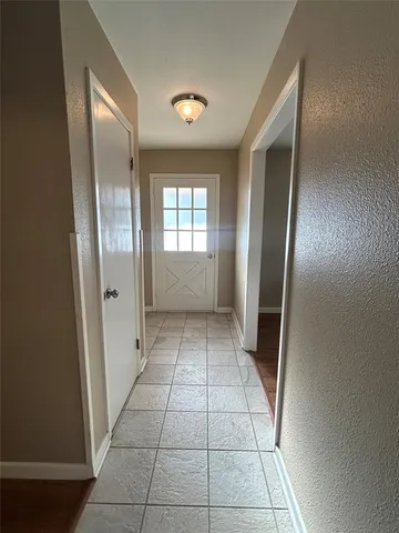 a view of empty room with windows