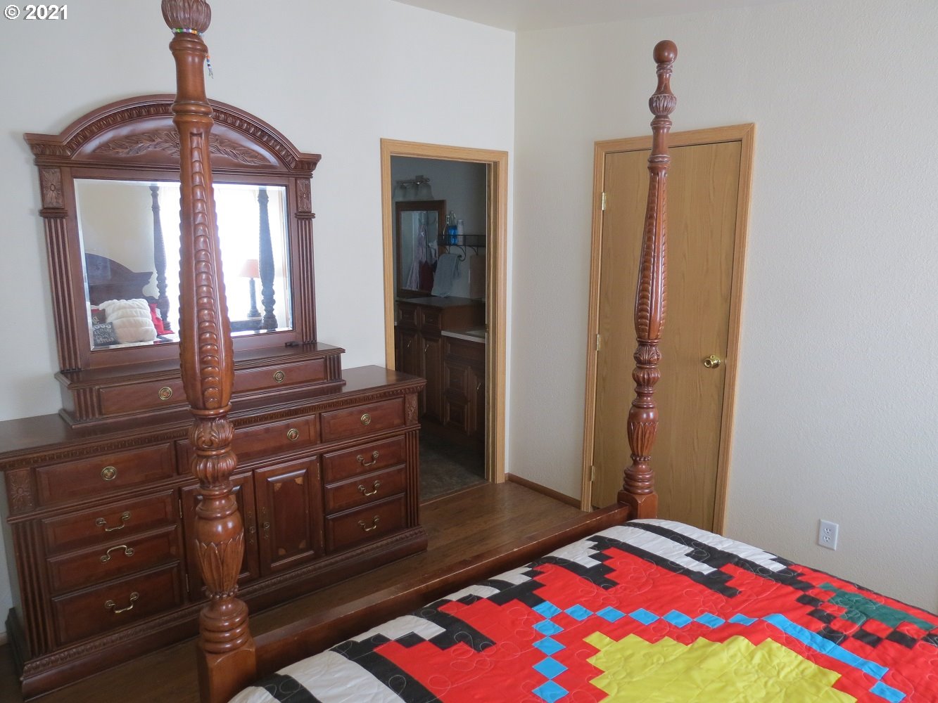 3032 Southwest Overlook Place Pendleton, OR 97801 - Photo 11 of 20 a bedroom with a bed and a dresser