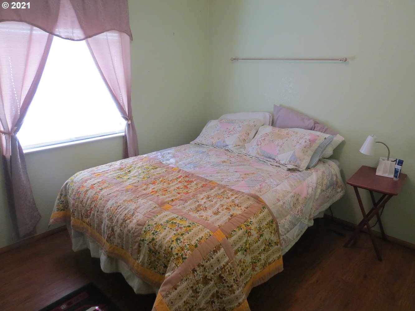 3032 Southwest Overlook Place Pendleton, OR 97801 - Photo 14 of 20 a bed sitting in a bedroom next to a window