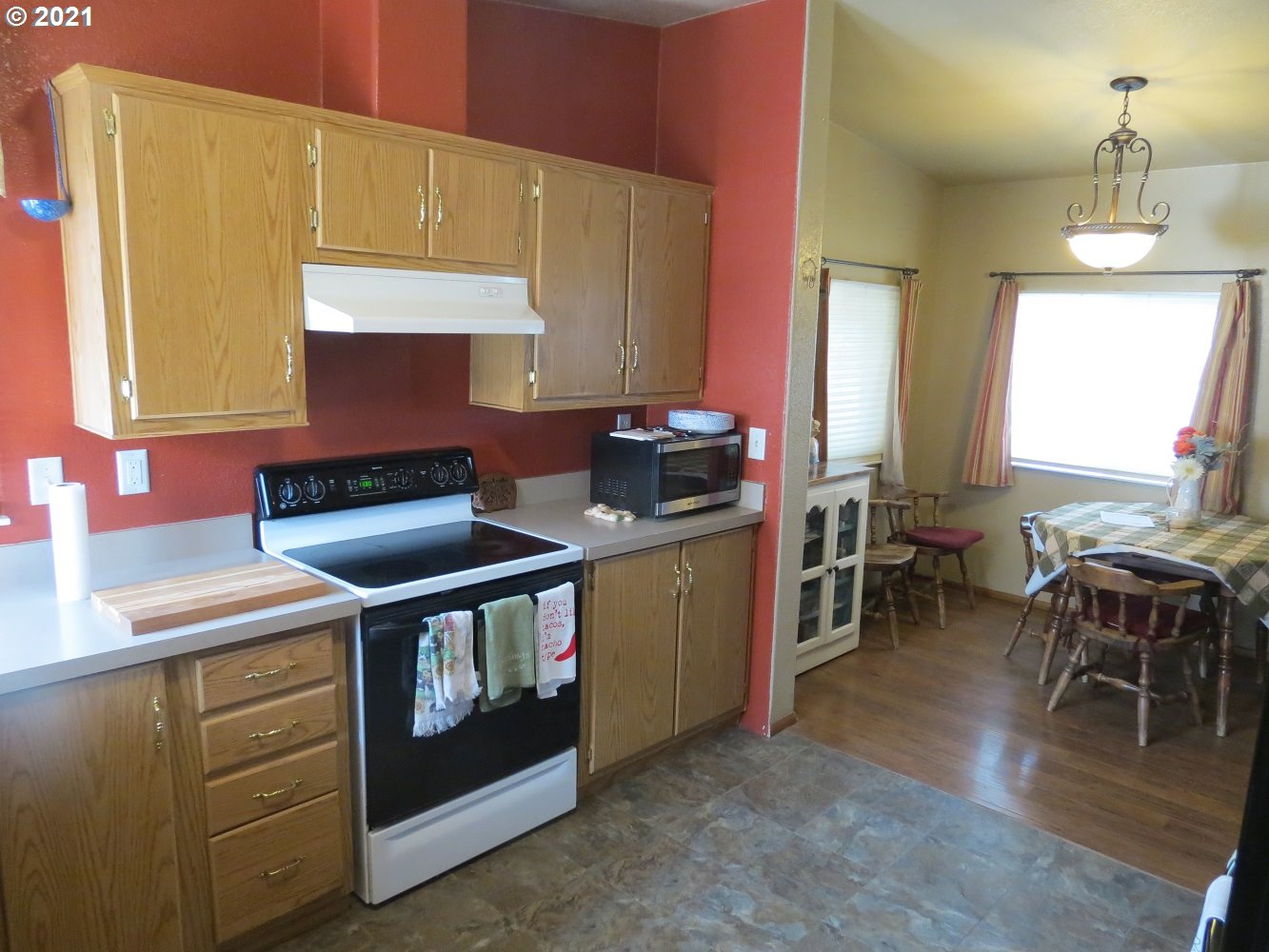 3032 Southwest Overlook Place Pendleton, OR 97801 - Photo 6 of 20 a kitchen with stainless steel appliances a stove a sink a counter space and dining table