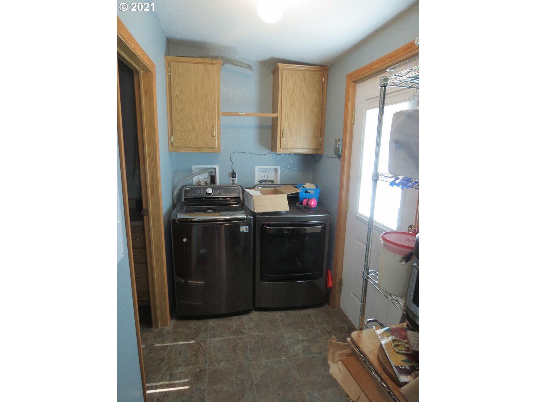 3032 Southwest Overlook Place Pendleton, OR 97801 - Photo 7 of 20 a utility room with a sink a washer and dryer