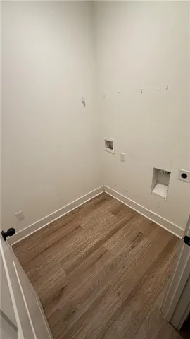 an empty room with wooden floor