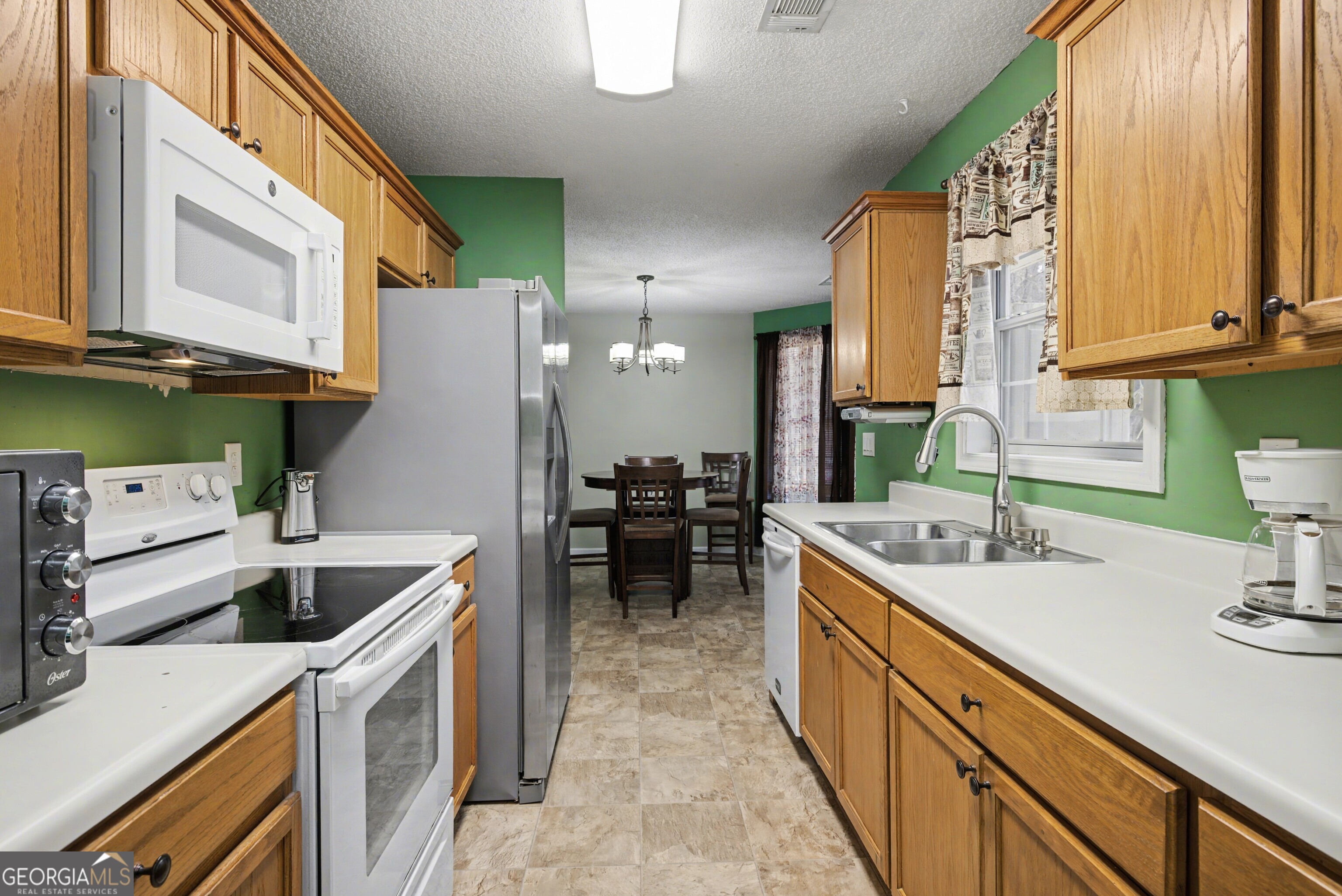 183 Buck Smith Road Hogansville, GA 30230 - Photo 11 of 28 a kitchen with a sink and cabinets