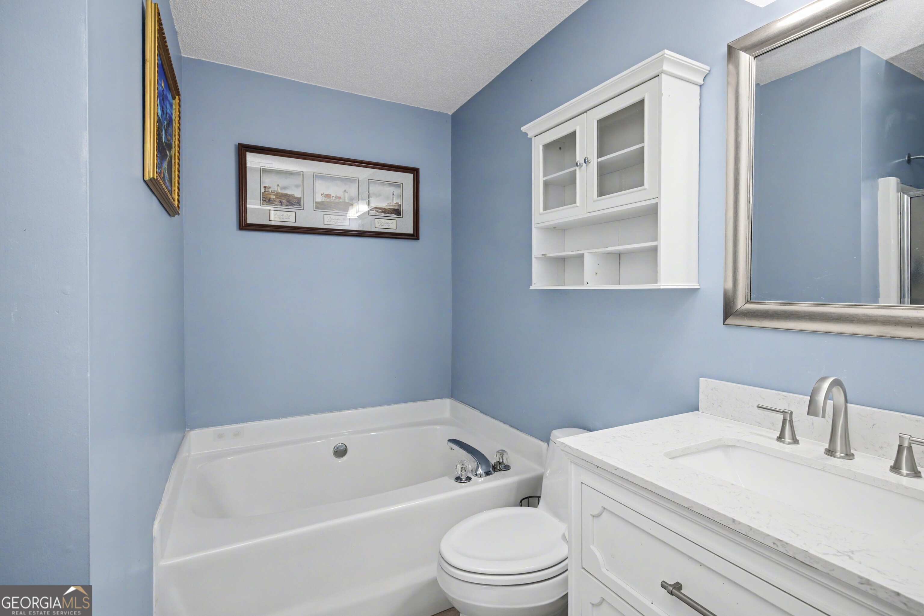 183 Buck Smith Road Hogansville, GA 30230 - Photo 15 of 28 a bathroom with a sink a toilet and shower