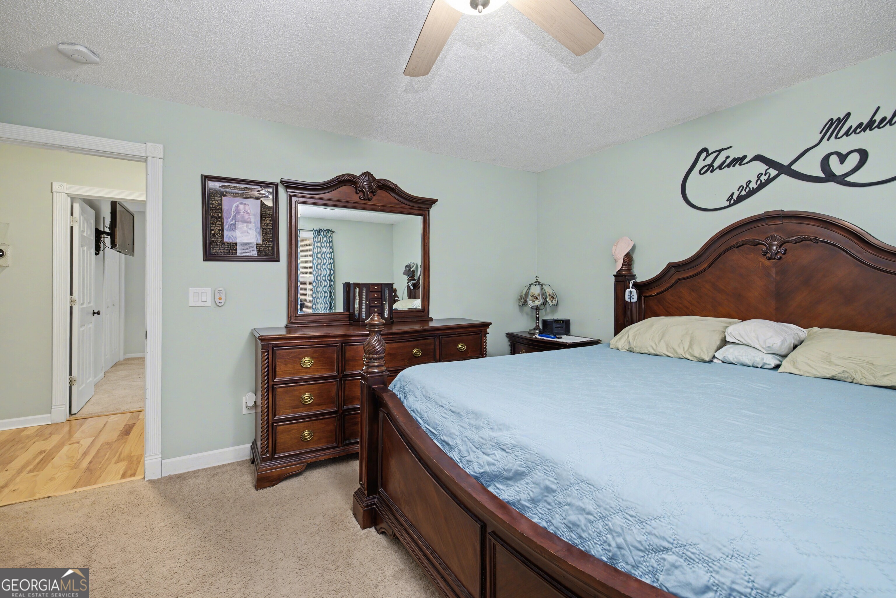 183 Buck Smith Road Hogansville, GA 30230 - Photo 19 of 28 a bedroom with a bed and a dresser