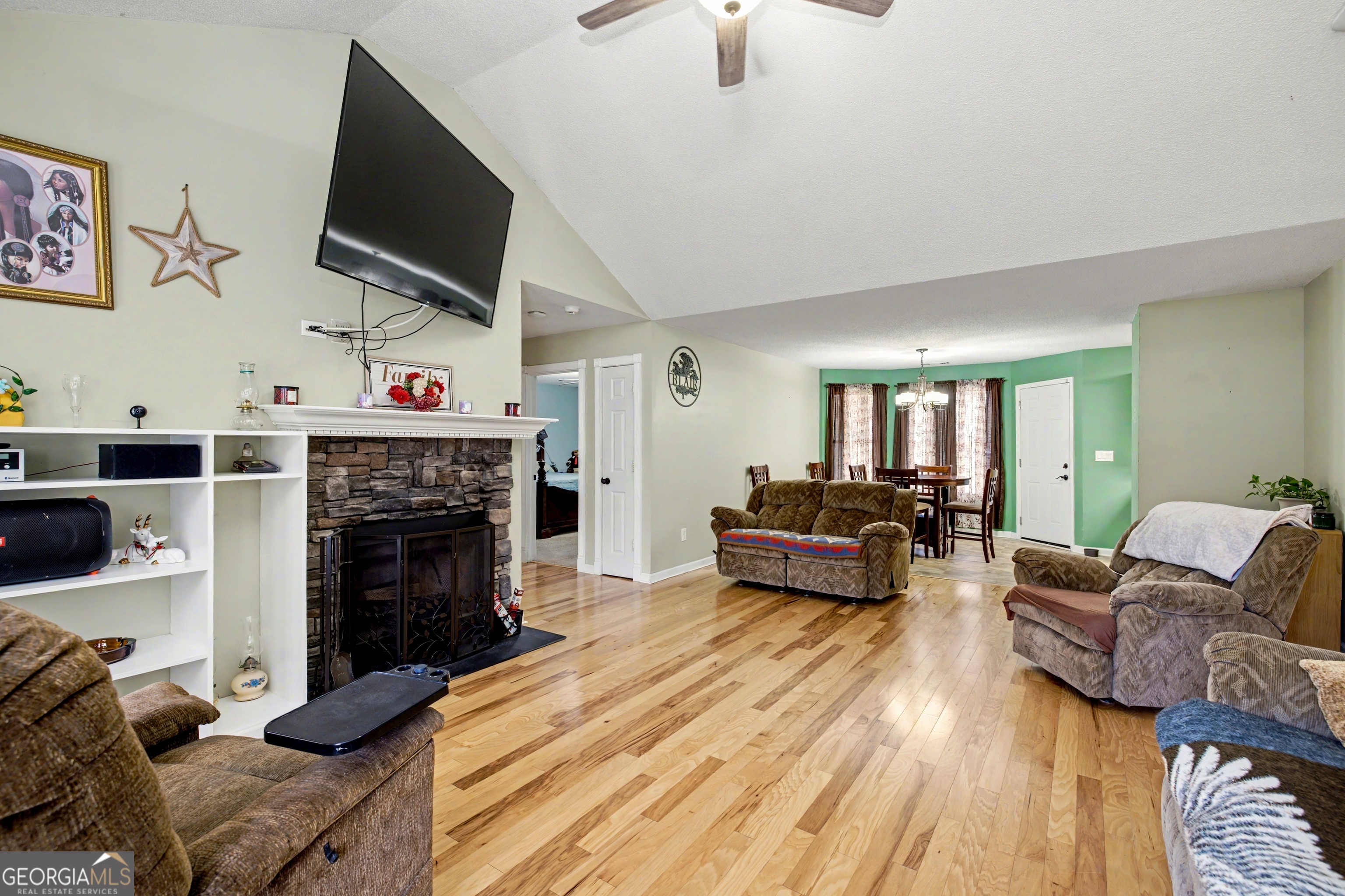 183 Buck Smith Road Hogansville, GA 30230 - Photo 5 of 28 a living room with furniture a flat screen tv and a fireplace