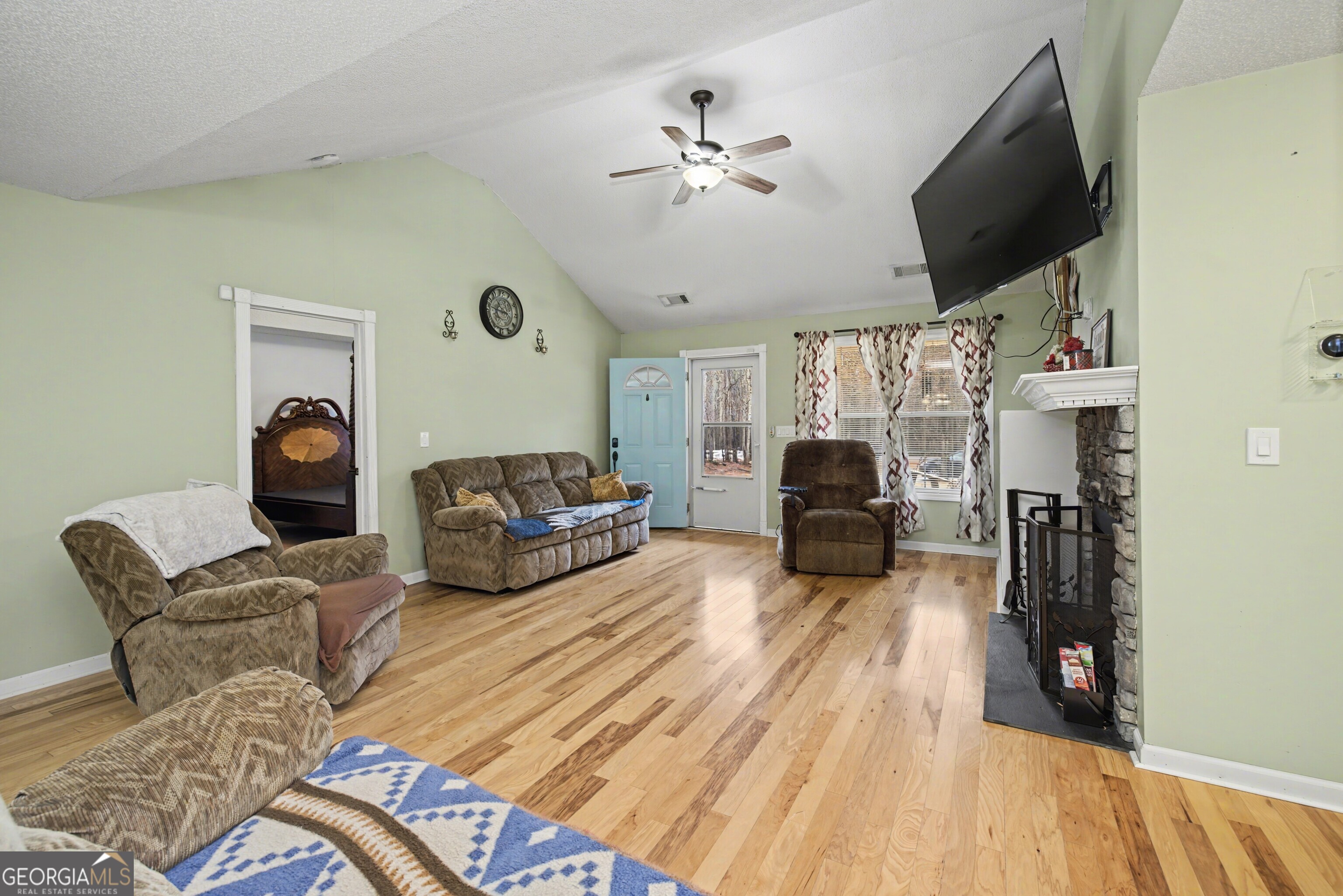 183 Buck Smith Road Hogansville, GA 30230 - Photo 8 of 28 a living room with furniture and a flat screen tv