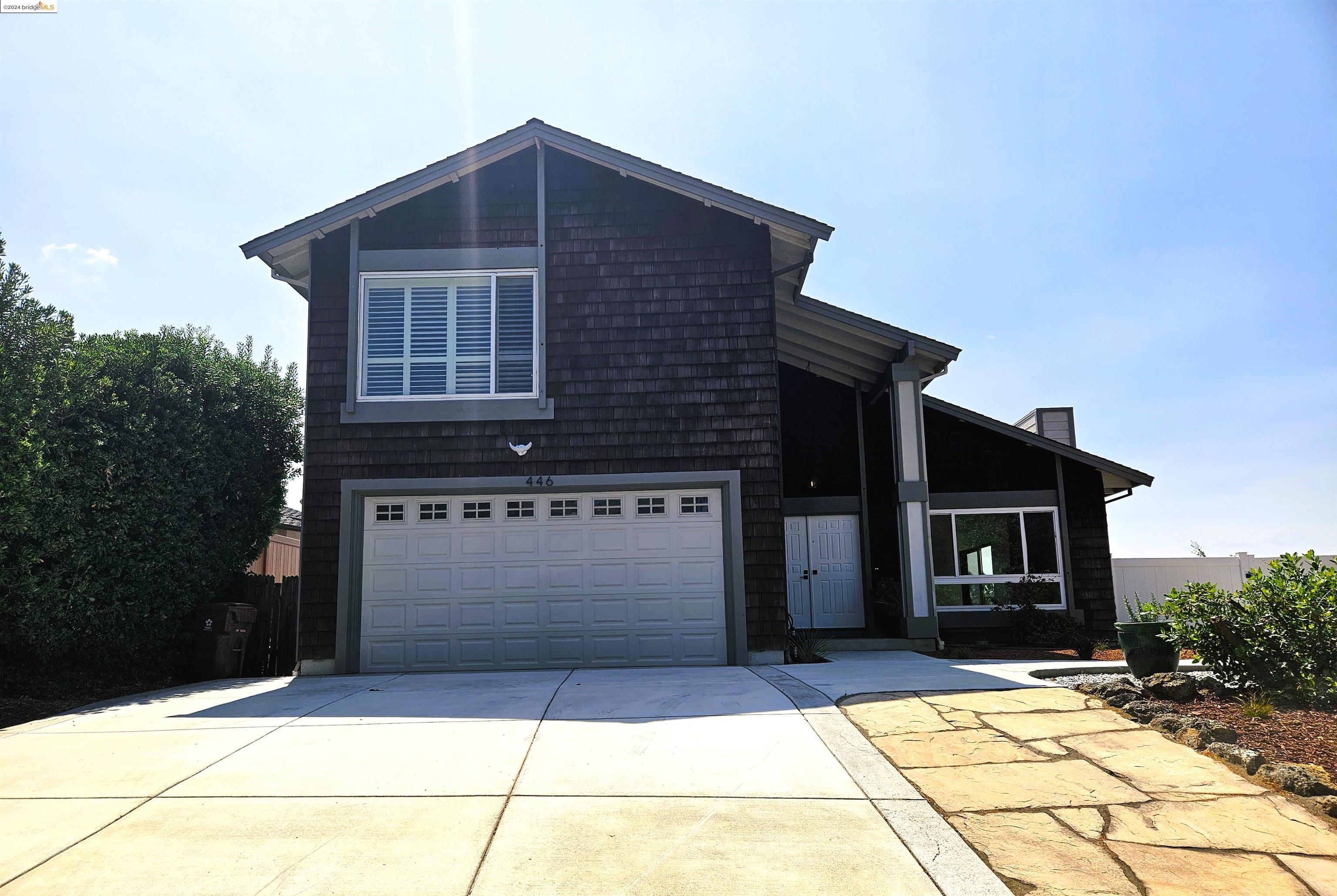 446 Warwick Drive Benicia, CA 94510 - Photo 1 of 1 a front view of a house with garage