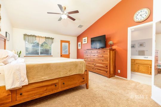 1217 Flora Way Ridgecrest, CA 93555 - Photo 21 of 39 a bed room with a bed and a television