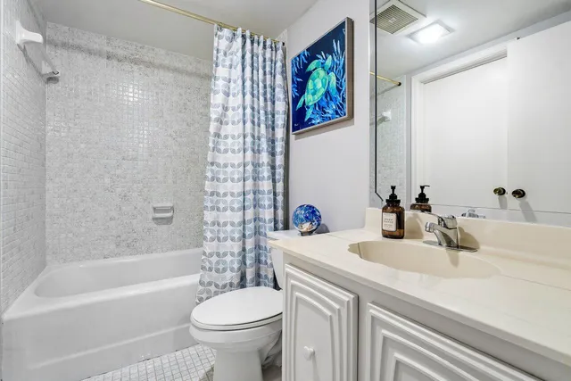 a bathroom with a sink a toilet and a bathtub