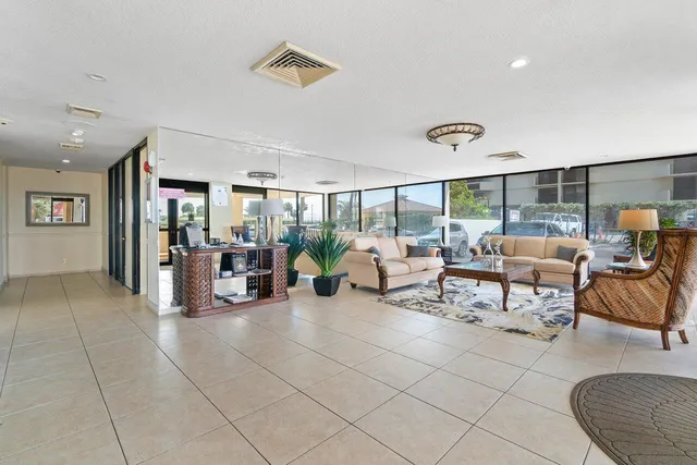 a living room with furniture and white walls