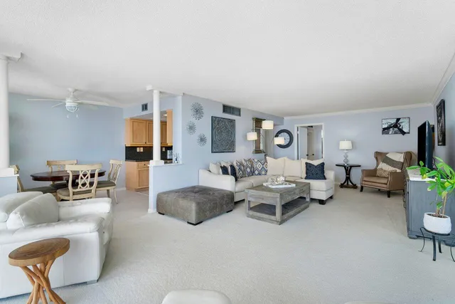 a living room with furniture and a table