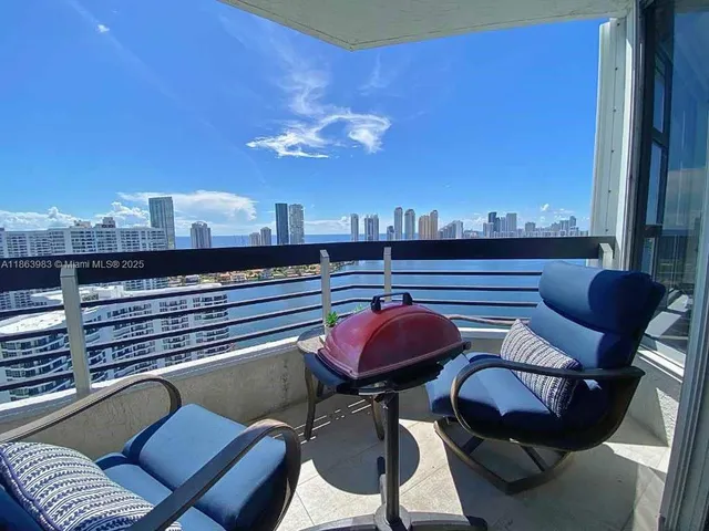 a view of a chairs and table in patio