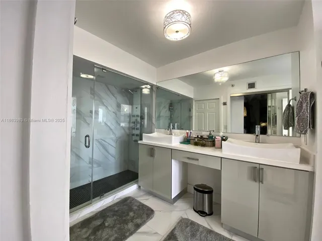 a kitchen with a sink and refrigerator