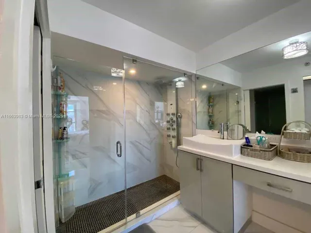 a bathroom with a sink and mirror