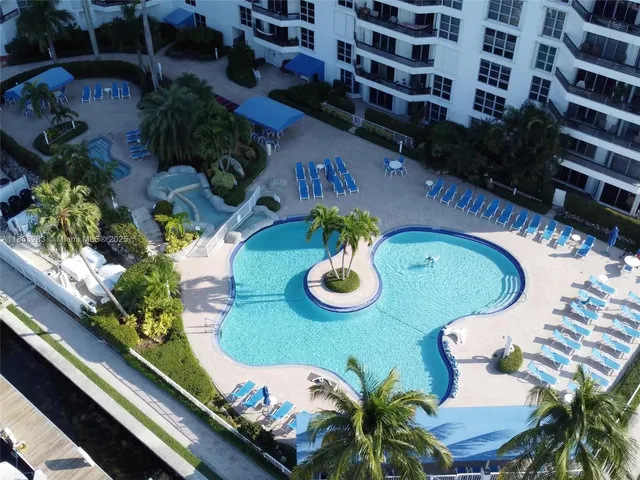 an aerial view of a dining table and chairs in the patio
