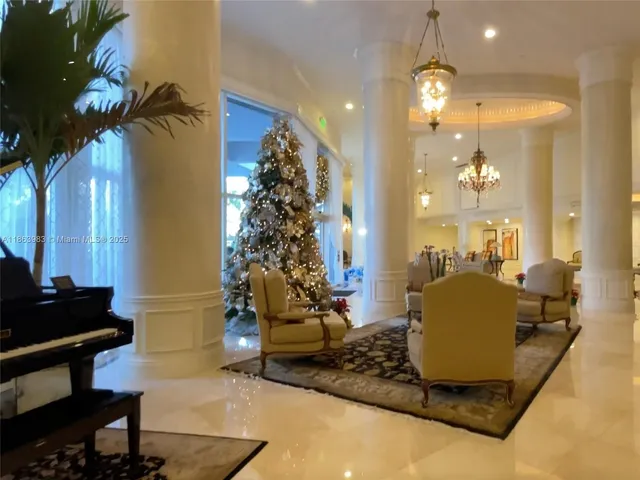 a room with gym equipment and a chandelier