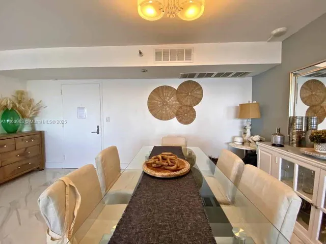 a living room with furniture and a mirror