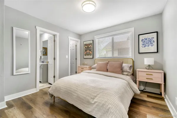 a bedroom with a bed and cabinets