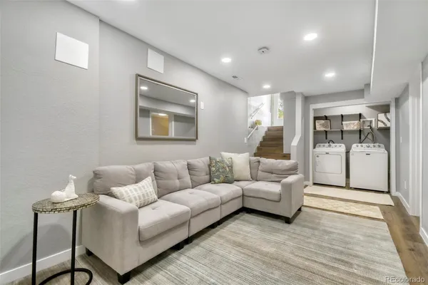 a living room with furniture and a rug
