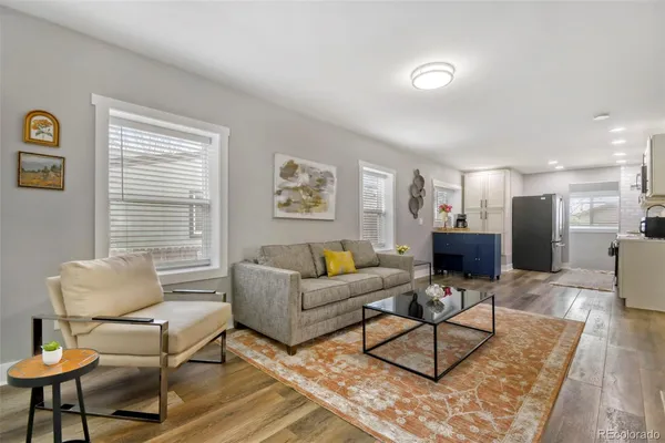 a living room with furniture and a table