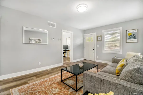 a living room with furniture and a window