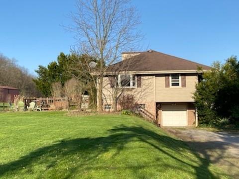 3545 Ellwood Road New Castle, PA 16101 - Photo 1 of 25 a front view of a house with a yard