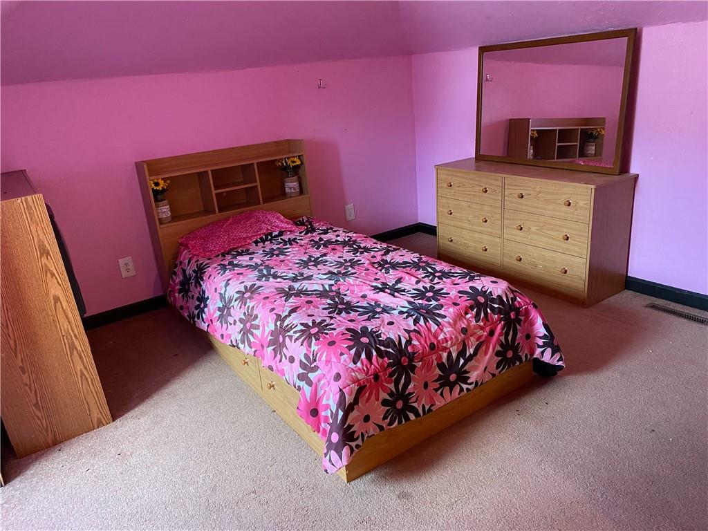 3545 Ellwood Road New Castle, PA 16101 - Photo 14 of 25 a bedroom with a bed and a dresser
