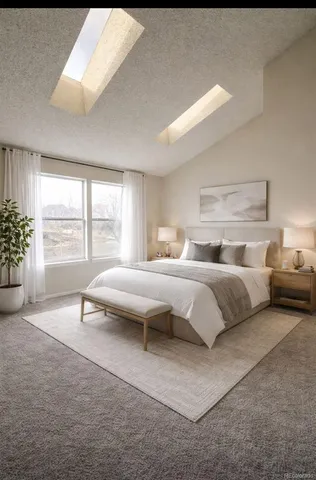 a bedroom with a large bed and a large window