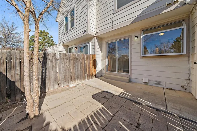 a view of a brick house with many windows