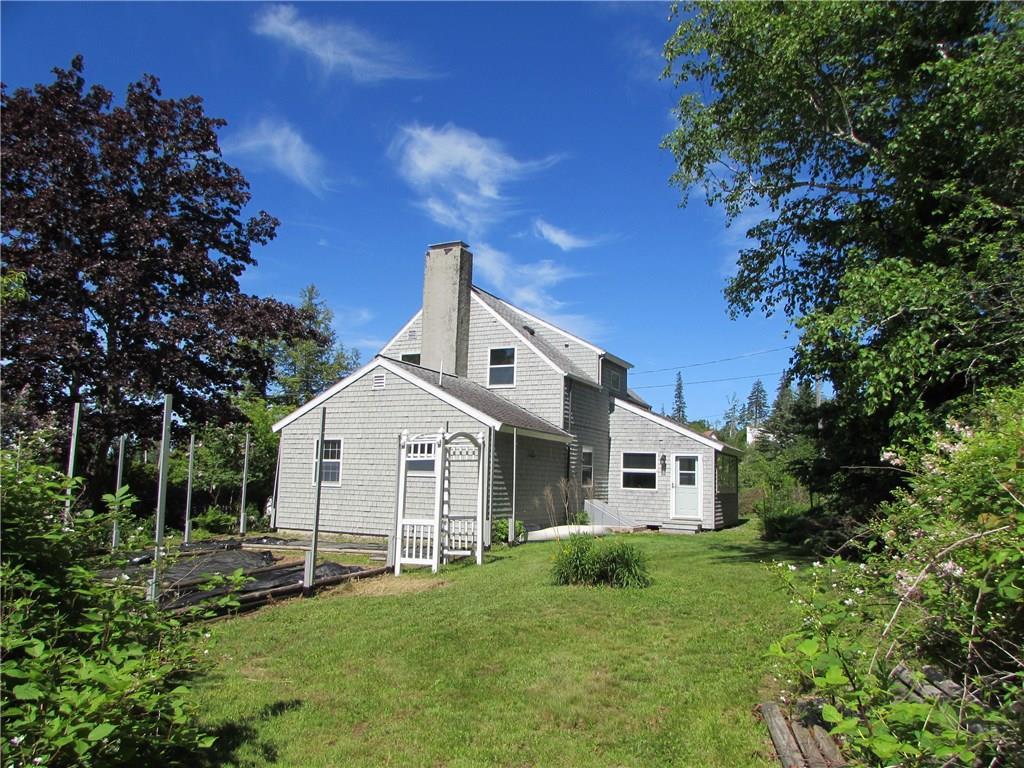 29 Madockawando Road Castine, ME 04421 - Photo 2 of 30 Side view of home and gardens