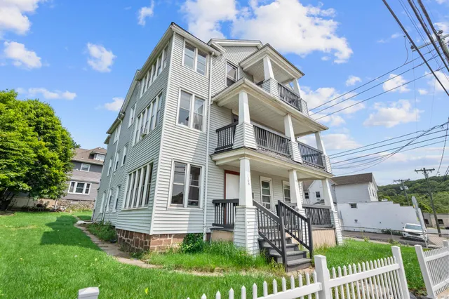 front view of a house with a yard