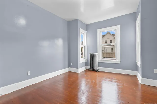 a view of livingroom with window wooden floor and window