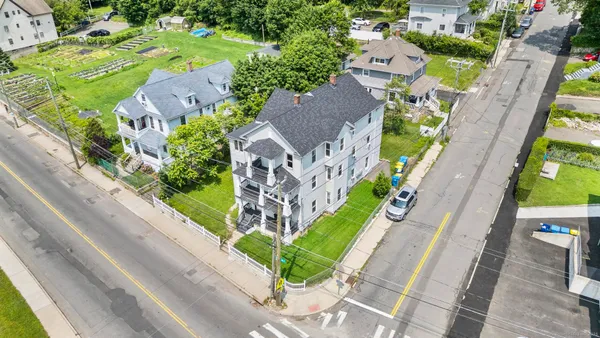 an aerial view of a house with a garden and plants