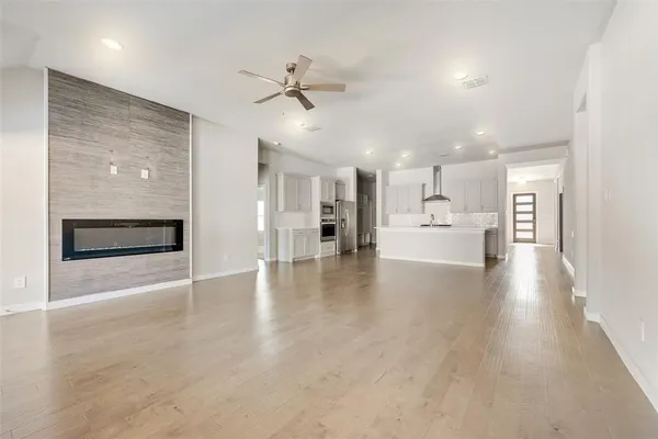 a kitchen with stainless steel appliances granite countertop a sink stove and cabinets