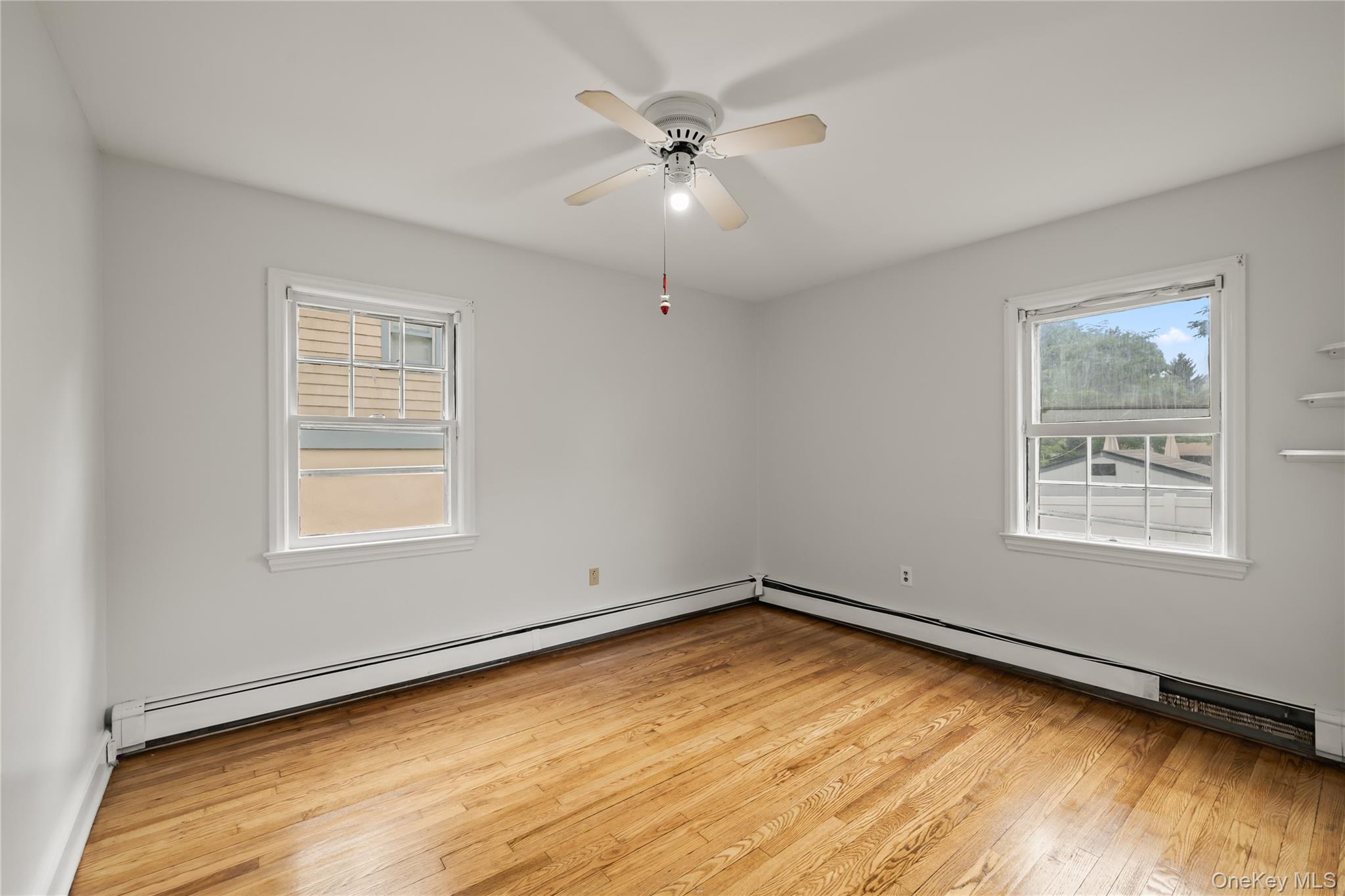 281-283 Old Haverstraw Road Congers, NY 10920 - Photo 15 of 41 wooden floor in an empty room with a window