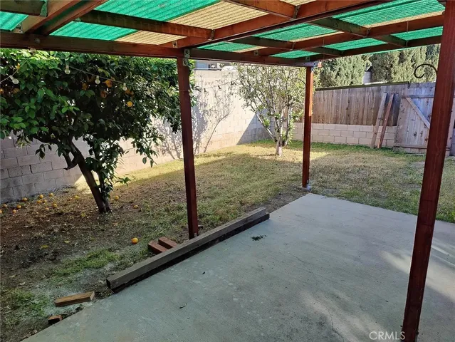 a kitchen with white cabinets and appliances