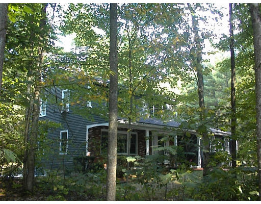 122 Haynes Road Townsend, MA 01469 - Photo 2 of 5 a view of house with trees in front of it