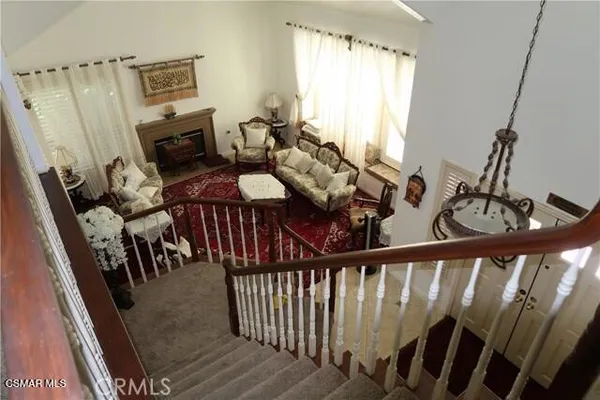 a view of a balcony with furniture