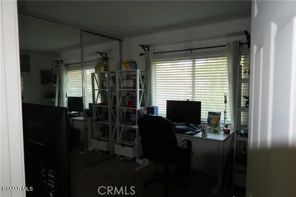 a view of a workspace with furniture