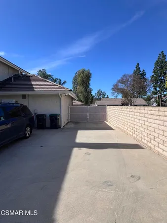 a view of a car parked in front of a house