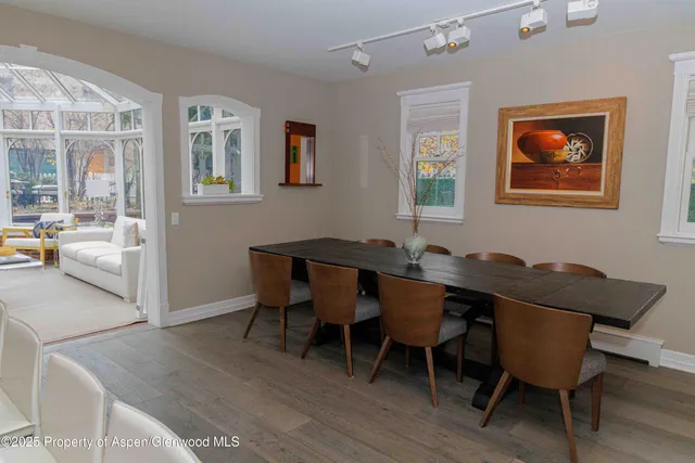 a view of a dining room with furniture window and wooden floor