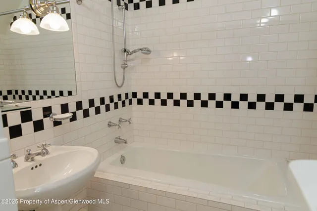 a utility room with sink dryer and washer