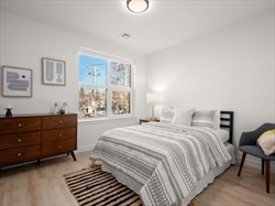 1151 Walnut Street, Unit 301 Newton, MA 02461 - Photo 12 of 14 a bedroom with a bed and a window