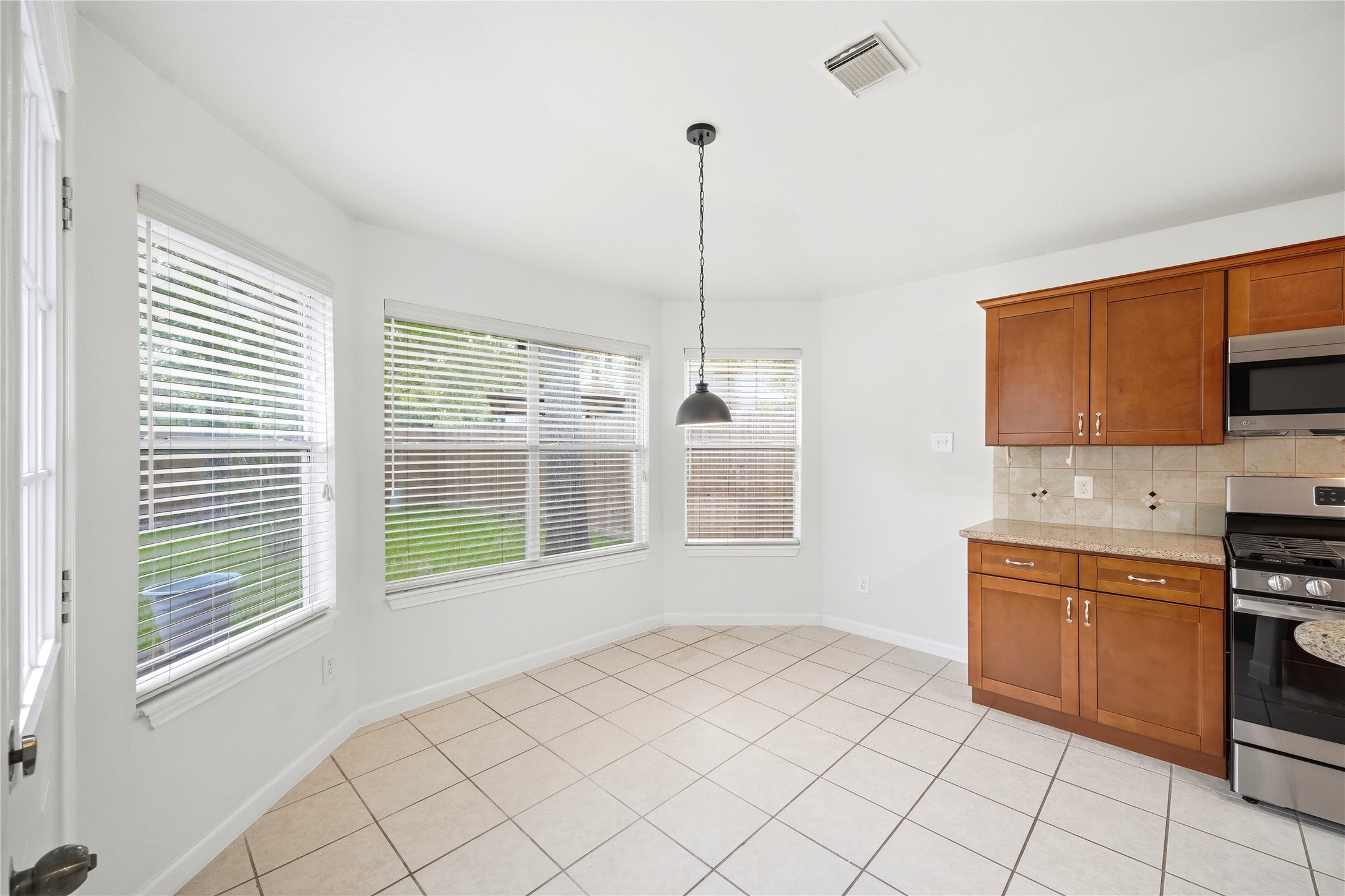 5411 Gate Canyon Court Spring, TX 77373 - Photo 11 of 33 a view of a kitchen with appliances cabinets and a window