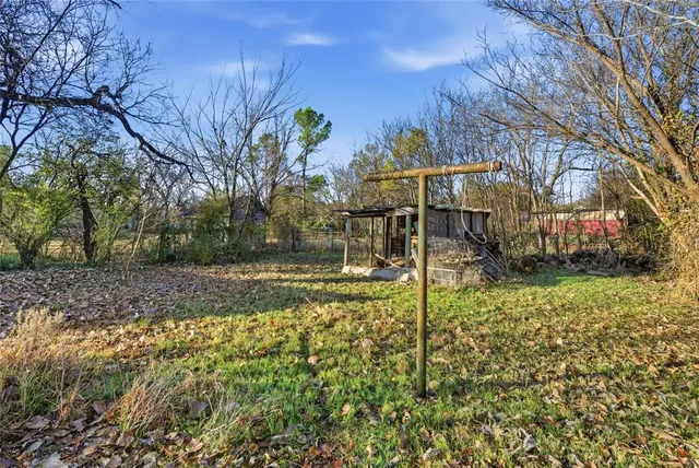 an empty room with large windows