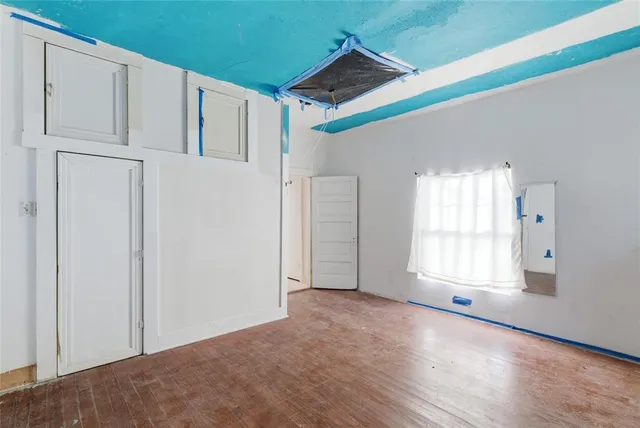 a view of a workspace with furniture and window